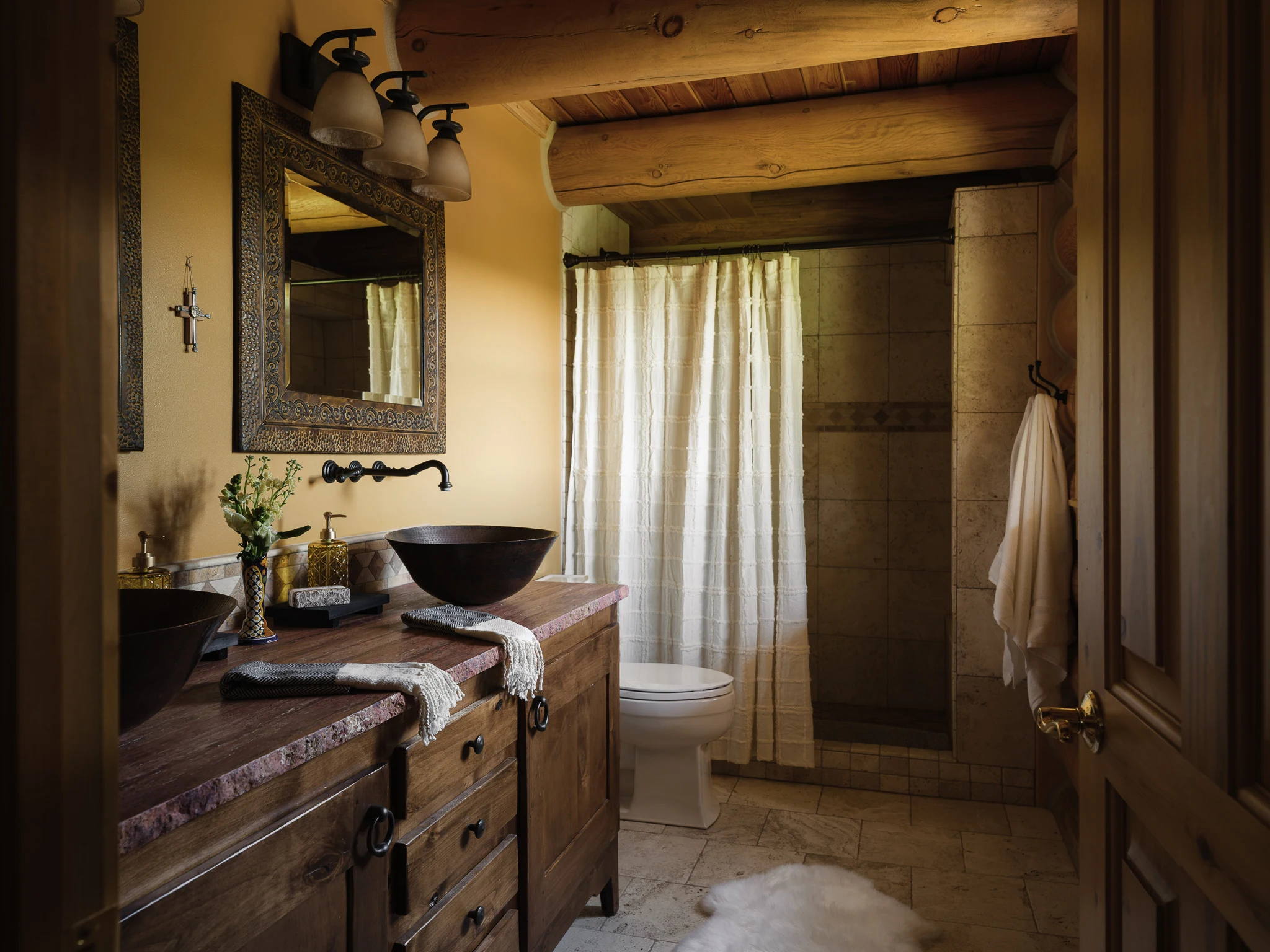 Bathroom with vessel sinks, a live-edge wood vanity, and walk-in shower — interior design photography Livingston Montana, Sam Schlauch Designs